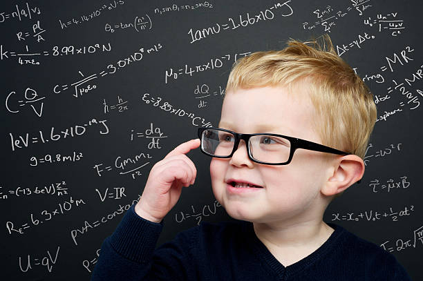 istock Smart young boy stood infront of a blackboard 160313410