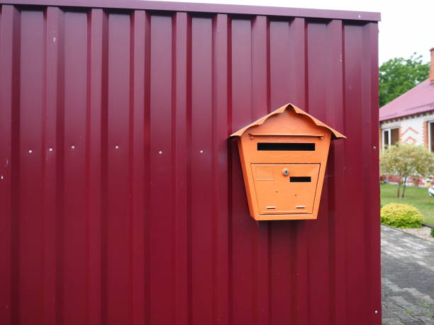 istock Mailbox on the red metal wall. Mailbox for correspondence. 1603135992