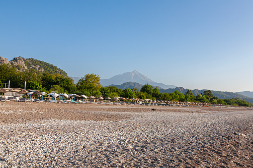 Empty sun loungers and sunrise at Cirali Beach in Antalya City, Turkey