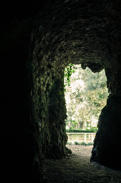 istock exit of a scary and creepy cave, toned image 160315318