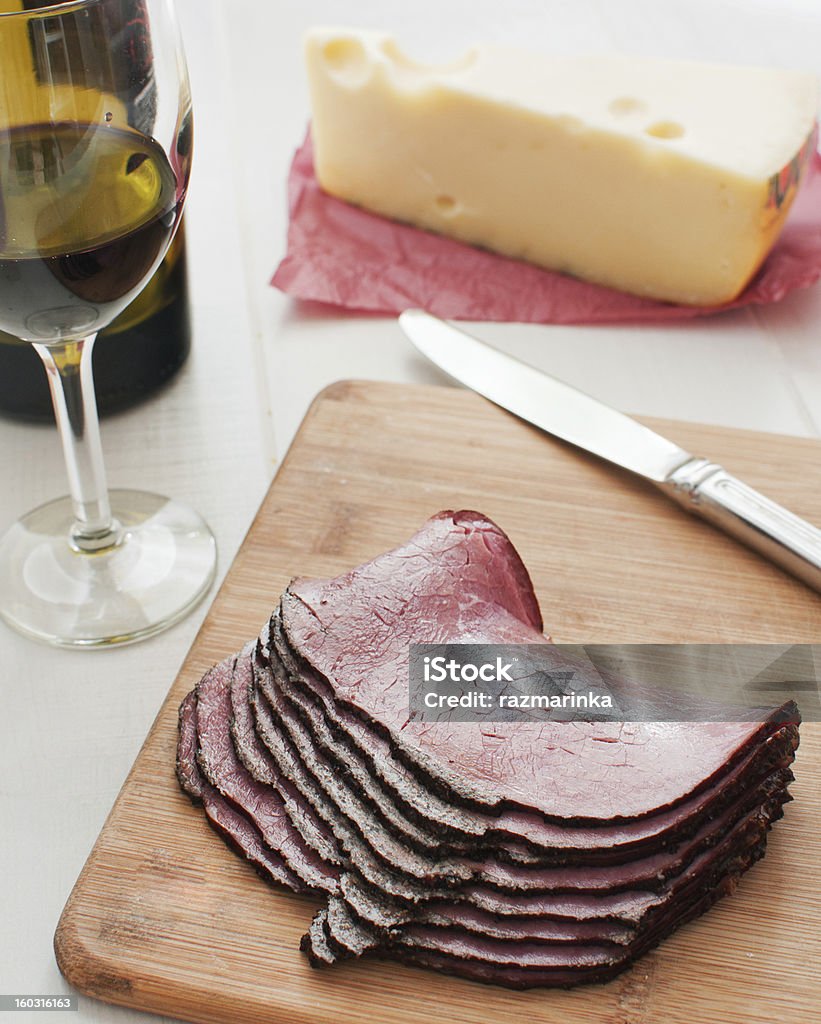 Sliced pastrami deli meat and wine Sliced pastrami deli meat and wine and cheese Roast Beef Stock Photo