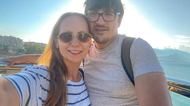 istock Couple makes selfie on smart phone while traveling in Antalya, Turkey 1603186218