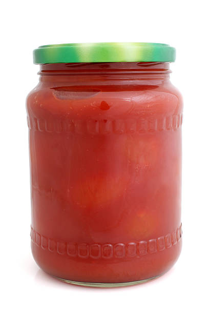Canned apples in syrup in a jar on a white background, Space for text