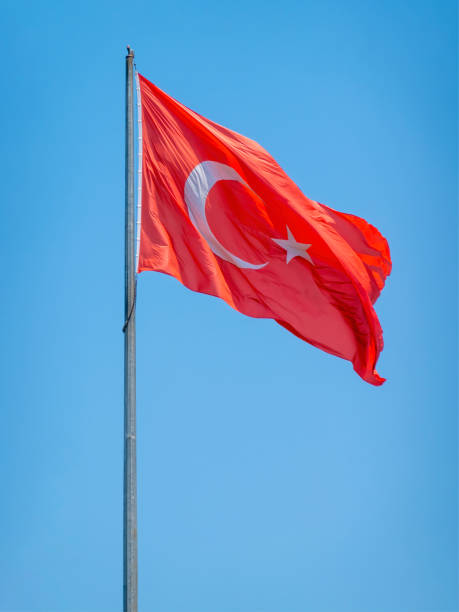 istock The Turkey flag against clear blue sky moving with the wind . 1603186765