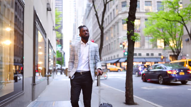 Affluent black businessman on a trip to NYC, window shopping