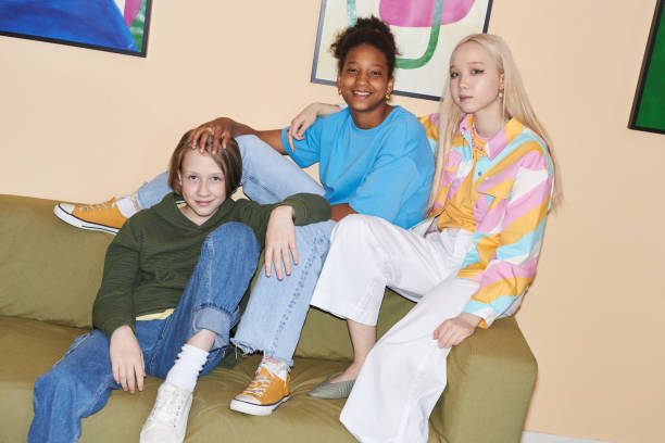 group of teenagers wearing colorful casual clothes indoors with flash - pre teen boy flash imagens e fotografias de stock