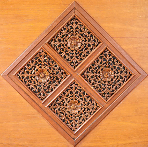 istock Pattern of flower carved on wood background 160320112