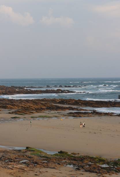 istock Walking people at the beach 1603216706