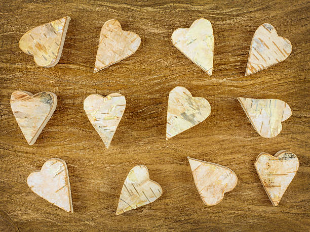 istock Wooden carved hearts on a brown background 160323217