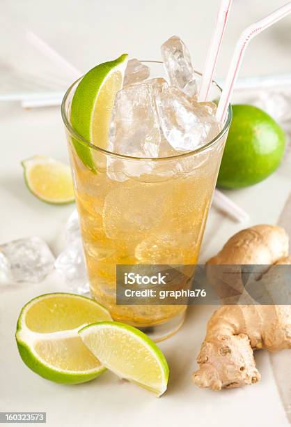 Yellow Drink With Lime Ginger And Ice Stock Photo - Download Image Now - Alcohol - Drink, Aperitif, Cocktail