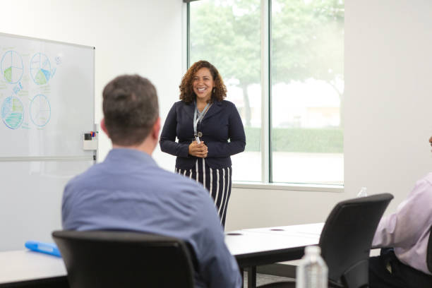 istock Female consultant speaks to unrecognizable employees 1603237278