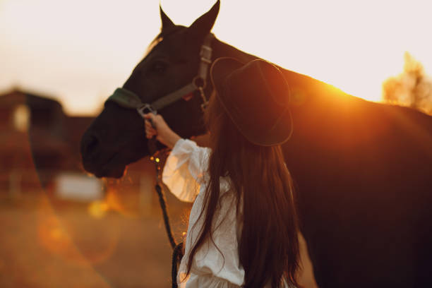 istock Woman with her horse at outdoors ranch 1603244939