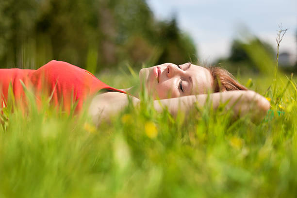 istock The woman lies on a grass. 160324675