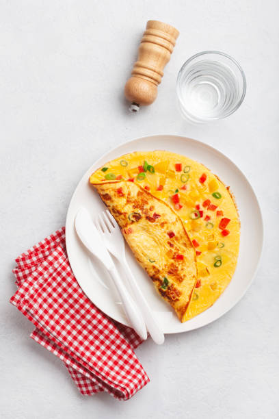 istock omelette with tomato, bell pepper onion and cheese. healthy breakfast 1603254609