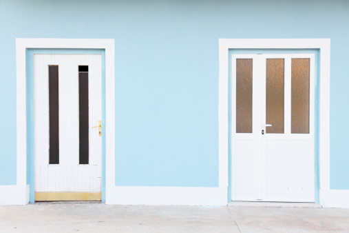 two blue and white doors  in house facade Croatia