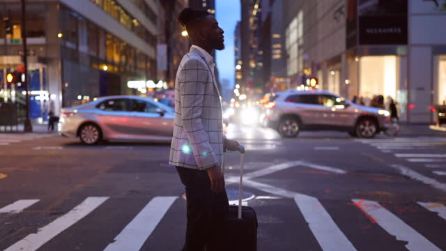 Affluent black businessman on a trip to NYC, zebra crossing
