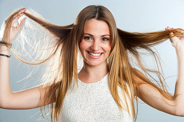 istock Attractive girl playing with hair. 160327701