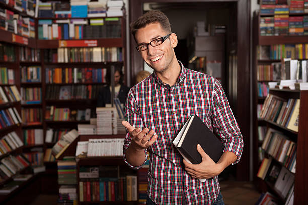 istock young caucasian guy in bookstore 160327717