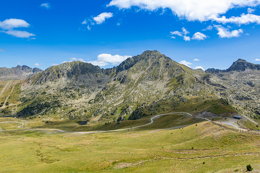 Camilo Encamp prairies in Andorran Pyrenees mountains during summer.\n\nGrandValira