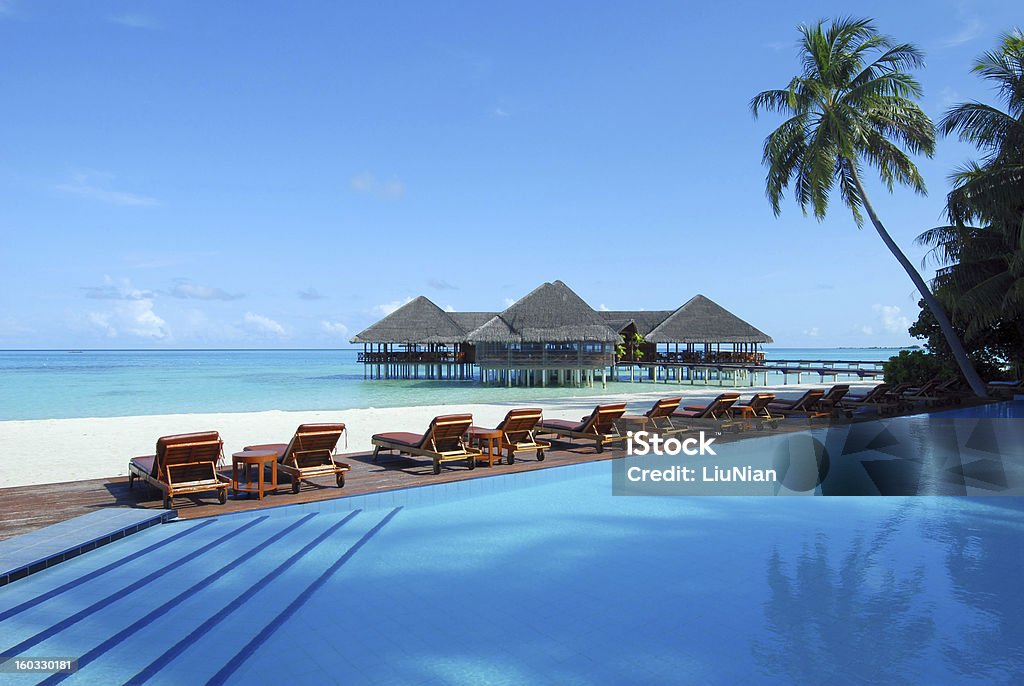 Tropical beach resort of maldives Cafe and swimming pool on the tropical beach Maldives Stock Photo