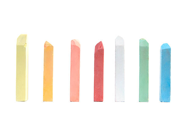 Pieces of colored chalk on a white background stock photo
