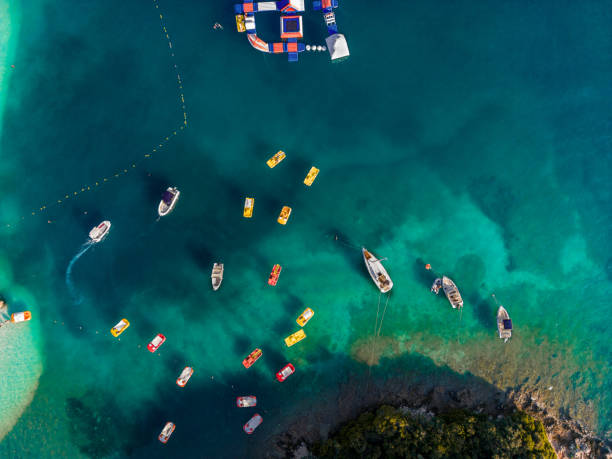 istock Top view of paddle boats by the coast, nice blue waters. 1603304879