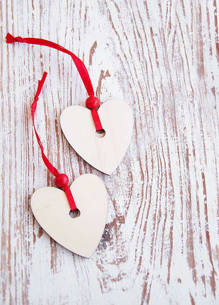 istock Hearts on wooden background 160330529