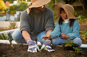 A Father and Daughter Planting Memories in the Garden