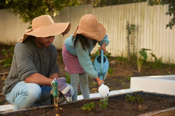 istock Bonding Through Greenery: A Father-Daughter Duo Nurturing Life in the Garden 1603307577