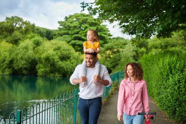 istock young family in the park 1603314568