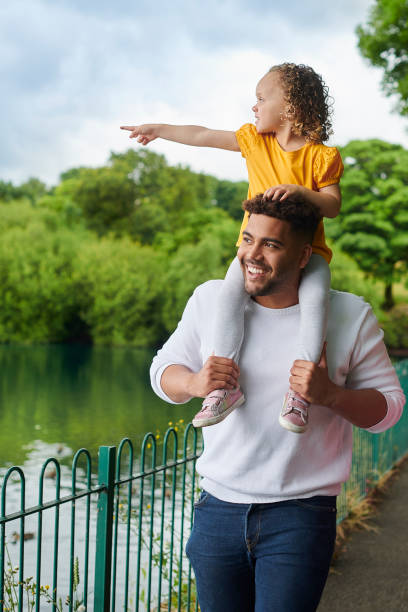 istock father and daughter in the park 1603315663