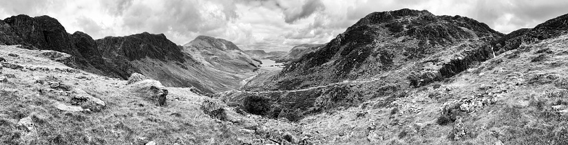 A dramatic view to black and white mountain and sky.