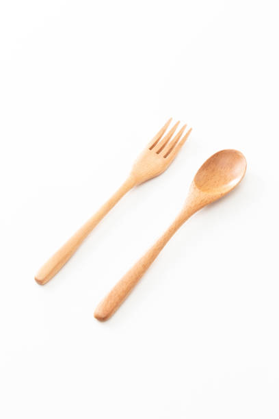 istock Wooden cutlery on white background. 1603348405