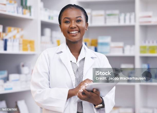 Portrait Of Black Woman In Pharmacy With Tablet Smile And Online Inventory List For Medicine On Shelf Happy Female Pharmacist Digital Checklist And Medical Professional Checking Stock In Store Stock Photo - Download Image Now