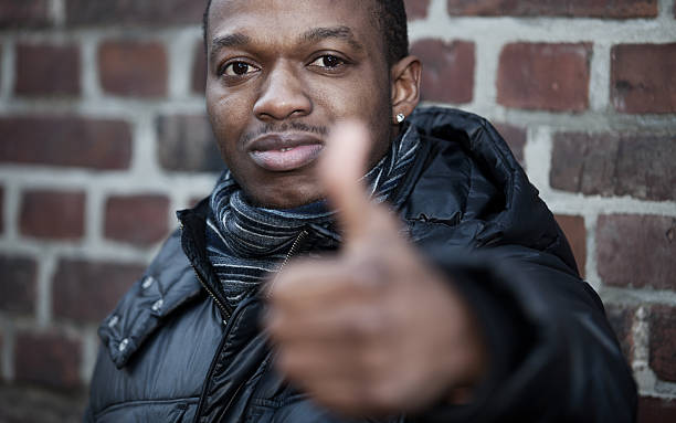 istock Casual black man showing thumbs up 160336815