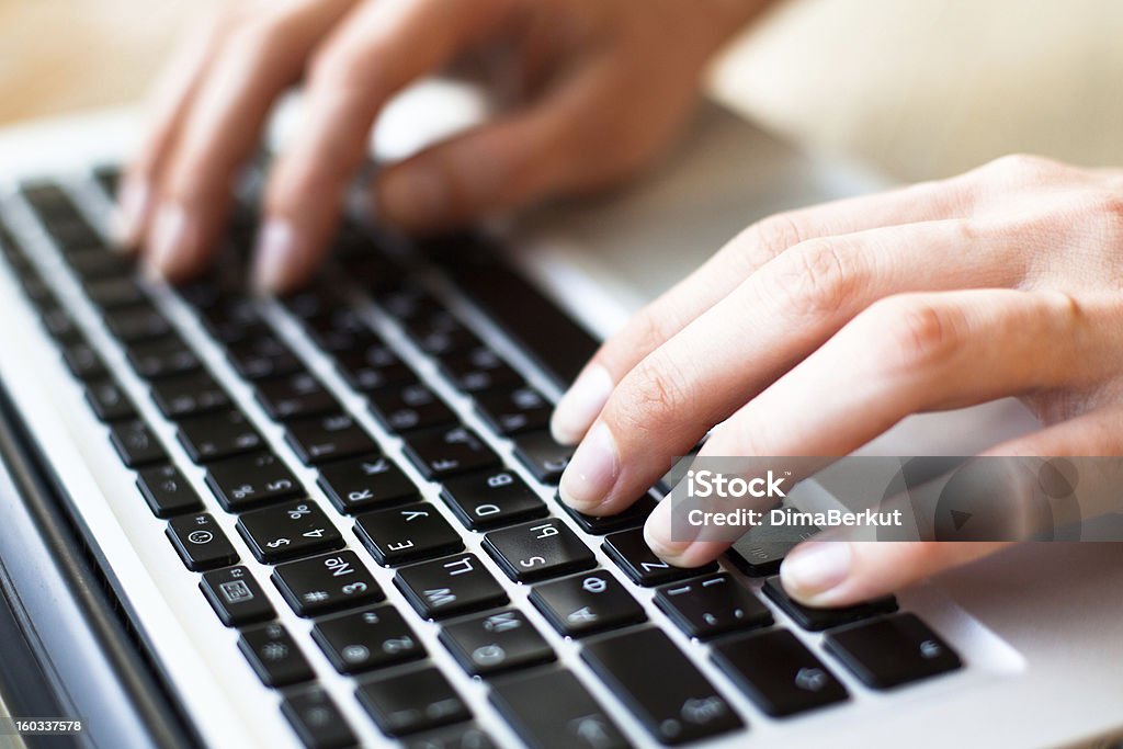 Hands typing on the laptop keyboard Business Stock Photo