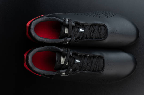 istock Pair of black leather gym shoes 1603377810