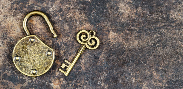 istock Vintage key and padlock, escape room game banner 1603381170
