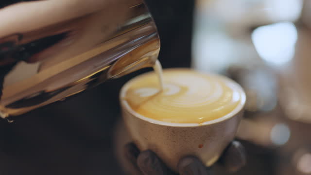 Barista making coffee process latte art