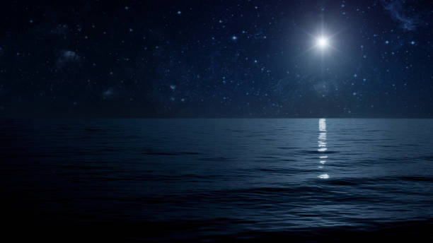 istock The moon shines on the sea 1603397834