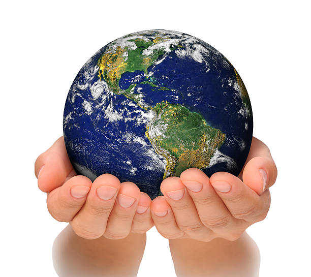 Woman holding globe on her hands, South and North America stock photo