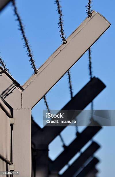 Barbed Wire Stock Photo - Download Image Now - Barbed Wire, Barricade, Blue