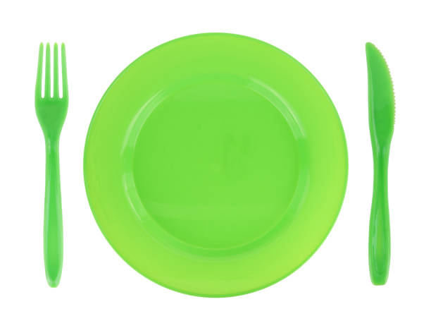 istock Green empty plate with fork and knife isolated on white transparent background, top view 1603442513