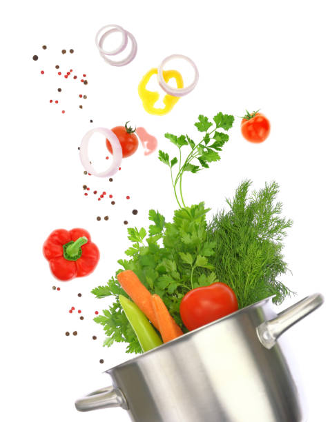 istock Fresh vegetables falling into a cooking pot isolated on white transparent background 1603443045