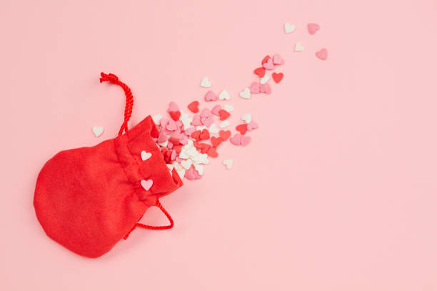 istock Red bag with hearts on a pink background 1603446833