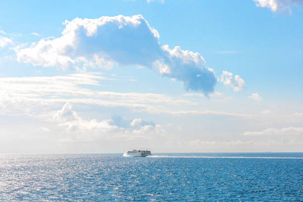 White cruise ship at sea on a sunny day. Beautiful seascape.