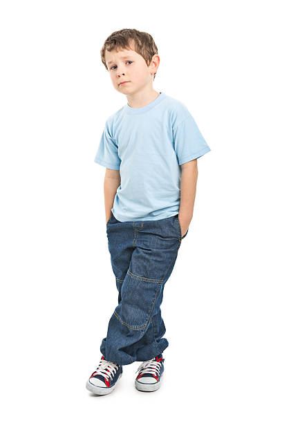 portrait of sad small boy portrait of small boy isolated on white sad child standing stock pictures, royalty-free photos & images