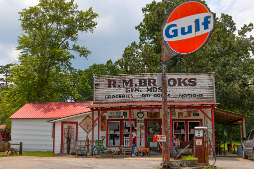 Rugby, Tennessee, USA - July 29, 2023:RM Brooks General Store with an old gas pump and Gulf Sign