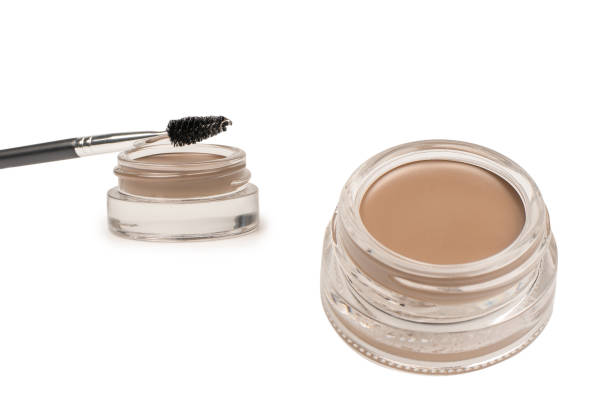 istock A brow pomade in blonde shade with brush isolated on a white background. 1603457776