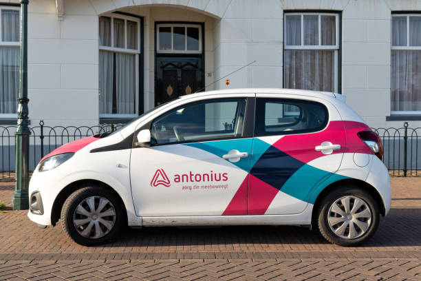 Colorful car on the quayside with skyscrapers in the background, at Rotterdam, Netherlands